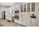 Modern white kitchen with stainless steel appliances and marble countertops at 5116 Tivoli Run, Bradenton, FL 34211