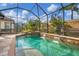 Inviting pool and spa with a waterfall feature at 5116 Tivoli Run, Bradenton, FL 34211