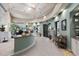 Spa reception area with a curved counter and calming color scheme at 5116 Tivoli Run, Bradenton, FL 34211