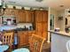 Kitchen with wood cabinets, an island, and breakfast nook at 5134 241St E St, Myakka City, FL 34251