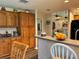 View of kitchen with island, breakfast bar, and fruit bowl at 5134 241St E St, Myakka City, FL 34251