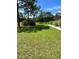 Expansive grassy yard with mature trees and a partially visible home at 5134 241St E St, Myakka City, FL 34251