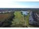 Aerial view of community with golf course and lake at 5211 Mahogany Run Ave # 124, Sarasota, FL 34241