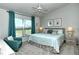 Relaxing main bedroom with king-size bed and golf course view at 5211 Mahogany Run Ave # 124, Sarasota, FL 34241