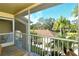 Screened balcony overlooking lush tropical landscape at 5211 Mahogany Run Ave # 124, Sarasota, FL 34241