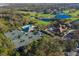 Aerial view of community tennis courts, pool, and golf course at 5224 88Th E St, Bradenton, FL 34211