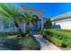 Landscaped walkway to elegant home entrance at 5224 88Th E St, Bradenton, FL 34211