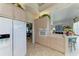 Kitchen with white appliances and light wood cabinets at 5224 88Th E St, Bradenton, FL 34211