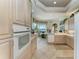 Kitchen with white appliances and light wood cabinets at 5224 88Th E St, Bradenton, FL 34211