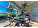 Outdoor kitchen with granite countertop and stainless steel grill at 5224 88Th E St, Bradenton, FL 34211