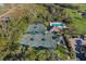 Aerial view of community tennis courts and swimming pool at 5224 88Th E St, Bradenton, FL 34211