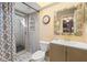 Bathroom with shower, toilet, vanity, and decorative mirror at 5348 Royal Palm Ave # 5348, Sarasota, FL 34234