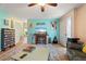 Living room with teal walls, comfy seating, and a large TV at 5348 Royal Palm Ave # 5348, Sarasota, FL 34234