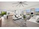 Bright living room with white sofas and open floor plan at 5351 Moeller Ave, Sarasota, FL 34233