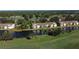 Aerial view of community with lake and golf course at 5360 Hyland Hills Ave # 2622, Sarasota, FL 34241