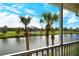 Scenic balcony view overlooking a tranquil lake and lush golf course at 5360 Hyland Hills Ave # 2622, Sarasota, FL 34241