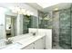 Elegant bathroom with a double vanity and a frameless shower at 5360 Hyland Hills Ave # 2622, Sarasota, FL 34241