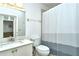 Clean bathroom with a shower and tub at 5360 Hyland Hills Ave # 2622, Sarasota, FL 34241