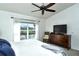 Bright bedroom with a king-size bed and view of the golf course at 5360 Hyland Hills Ave # 2622, Sarasota, FL 34241