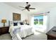 Spacious bedroom with a king-size bed and large window at 5360 Hyland Hills Ave # 2622, Sarasota, FL 34241