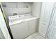 Functional laundry room with washer and dryer at 5360 Hyland Hills Ave # 2622, Sarasota, FL 34241