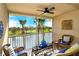 Screened patio overlooking a lake and golf course at 5360 Hyland Hills Ave # 2622, Sarasota, FL 34241