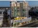 Luxury highrise building at dusk, showcasing the city lights at 540 N Tamiami Trl # 802, Sarasota, FL 34236