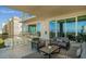 Spacious balcony with outdoor furniture and water views at 540 N Tamiami Trl # 802, Sarasota, FL 34236