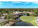 Aerial view of community clubhouse near the golf course at 5655 Pipers Waite # 27, Sarasota, FL 34235