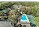 Aerial view of community amenities including pool, tennis courts, and clubhouse at 5655 Pipers Waite # 27, Sarasota, FL 34235