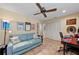 Multipurpose bedroom with sofa, workspace, and built-in closet at 5655 Pipers Waite # 27, Sarasota, FL 34235