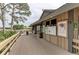 Clubhouse entrance with deck and informational boards at 5655 Pipers Waite # 27, Sarasota, FL 34235