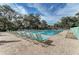 Inviting community pool with plenty of lounge chairs at 5655 Pipers Waite # 27, Sarasota, FL 34235