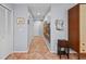 Bright hallway with tile flooring and ample closet space at 5655 Pipers Waite # 27, Sarasota, FL 34235