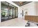 Bright and spacious lobby with modern wood and metal accents at 5655 Pipers Waite # 27, Sarasota, FL 34235