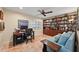 Home office features built-in bookshelves and a workspace at 5655 Pipers Waite # 27, Sarasota, FL 34235