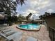 Inviting community pool with lounge chairs and a spa at 5655 Pipers Waite # 27, Sarasota, FL 34235