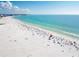 Expansive beach view with clear water and people enjoying the sand at 567 Venice Ln, Sarasota, FL 34242