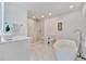 Bathroom with a large soaking tub and walk-in shower at 567 Venice Ln, Sarasota, FL 34242