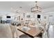 Kitchen and dining area with large table and white cabinets at 567 Venice Ln, Sarasota, FL 34242