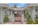 Welcoming entryway with decorative gate and lush tropical plants at 567 Venice Ln, Sarasota, FL 34242