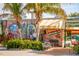 Vibrant building exterior with unique murals and patio seating at 567 Venice Ln, Sarasota, FL 34242