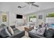 Living room with pool view, two sofas, and a coffee table at 567 Venice Ln, Sarasota, FL 34242