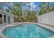 Relaxing kidney-shaped pool with spa and private backyard at 567 Venice Ln, Sarasota, FL 34242