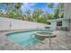 Clean pool and spa with gray pavers and private fence at 567 Venice Ln, Sarasota, FL 34242