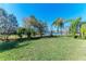 Landscaped backyard with lake view and privacy fence at 5811 100Th E Ave, Parrish, FL 34219