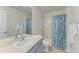 Clean bathroom with double sinks, a shower/tub combo, and teal accents at 5811 100Th E Ave, Parrish, FL 34219