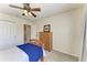 Light and airy bedroom with a wooden bed frame and ample closet space at 5811 100Th E Ave, Parrish, FL 34219