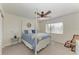 Spacious bedroom with a four-poster bed and a ceiling fan at 5811 100Th E Ave, Parrish, FL 34219