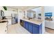 Modern kitchen with stainless steel appliances and blue cabinetry at 5811 100Th E Ave, Parrish, FL 34219